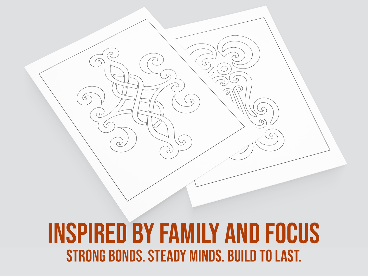 Two sheets of paper with intricate patterns on a gray background, featuring text about family and focus.