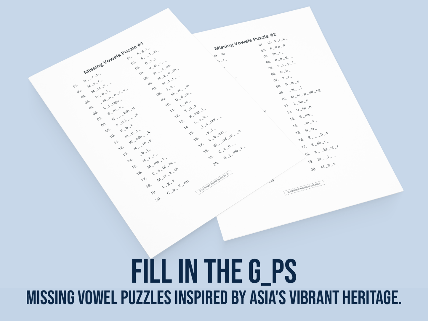 Two sheets of paper with missing vowel puzzles on a light blue background.