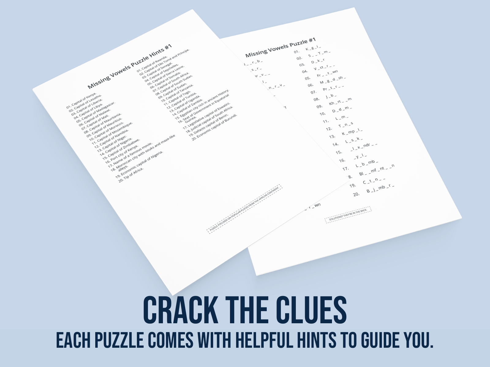 Two sheets of paper with missing vowels puzzles on a light blue background.